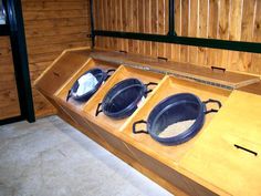 three pans sitting on top of a wooden counter