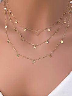 Tiny 14k gold filled or 925 sterling silver delicate coin disc necklace , This three layered come up with separate each clasp, so you could wear single or layered style. Beautiful, stylish and trendy. It makes of.. -3 of 3.8mm 14k gold fill ( not gold plated ) or Sterling silver , -14k gold fill (not gold plated ) or Sterling silver cable chain with spring claw. -Come up with beautiful ribbon gift box and -One set of Care instruction package that enhance your present. I offer high quality 14k go Dainty Necklace With Coin Pendant, Dainty Coin Pendant Necklace, Dainty Charm Necklace With Coin Pendant, Dainty 14k Gold Filled Coin Necklace, Dainty Chain Necklace With Coin Pendant, Dainty Round Layered Necklace, Dainty Adjustable Charm Necklace With Coin Pendant, Delicate Style Coin Necklace With Delicate Chain, Delicate Coin Necklace With Round Shape