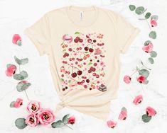 Cherry Cottage Core Shirt Cottage garden dreams are made with this tee. Pair it with a comfy cardigan and rock your cherry love at a spring or summer festival! Or French tuck it and enjoy being extra kawaii at home. 🌺 🍄 All the cute cottage feels. 🍄 ❤ Want another version? ❤ Go here: RASPBERRY: https://www.etsy.com/listing/992131652/raspberry-cottage-core-t-shirt-raspberry BLUEBERRY: https://www.etsy.com/listing/1007008263/blueberry-cottage-core-t-shirt-blueberry BLACKBERRY: https://www.etsy. Strawberry Clothes, Apple Clothes, Strawberry Cottage, Clothing Cottagecore, Kawaii Cottagecore, Garlic Festival, Cherry Shirt, Strawberry Aesthetic, French Tuck