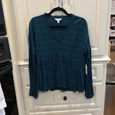 Purchased This For Myself And Probably Should Have Taken It Back But I Thought I Would Lose Weight And Get Into It. Well.. Hasn’t Happened. It Is Nwt!! Done In A Gorgeous Teal Color In A Tone On Tone Stripe. Ruffled V-Neck. Very Blousy Long Sleeved W/ Buttoned Cuff. Has Ruffled Front And Back. You Wish It Fit! Fall V-neck Peasant Top With Ruffles, Blue Peasant V-neck Top, Blue Peasant Top For Fall, Blue Peasant Style V-neck Top, Blue Long Sleeve Peasant Top For Fall, Red Floral Blouse, Lace Long Sleeve Shirt, Bohemian Blouses, Orange Blouse