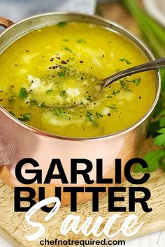 garlic butter sauce in a copper pot on a cutting board with parsley and cilantro