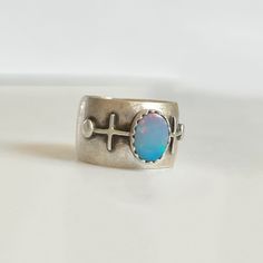 one-of-a-kind! sterling silver & australian opal i highly recommend sizing up a half to full size with this ring. wide ring bands will feel tighter than a more traditional ring band. ring size: us 6.75 (fits best on us size 5.75-6.25) please make sure you measure your ring size as i cannot resize this ring. handmade be me, in my austin, tx studio. you may see small marks & imperfections. or as i like to call them, wabi-sabi marks. Traditional Ring, Ring Bands, Wide Ring, Wide Rings, Wide Band Rings, Original Bags, Purple Hues, Australian Opal, Wide Bands