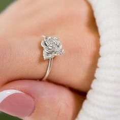 Embrace the beauty of nature with our 3D-printed Rose Ring. This intricately crafted piece captures the essence of a blooming rose, making it a stunning accessory for flower enthusiasts and nature lovers alike. Whether as a gift or a treat for yourself, this delicate and dainty ring is sure to make a lasting impression. Size: Varies by size about 2.5-3.5 tall and 1.2-1.3 thick Rose Making, Rose Flower Ring, Dainty Rose, The Beauty Of Nature, Solid Gold Chains, Rose Ring, Blooming Rose, Lovely Jewellery, Dainty Ring