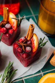 two desserts with fruit and cinnamon garnish on them