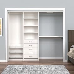 an empty bedroom with a bed, dresser and white closets in it's corner