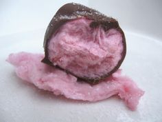 a piece of chocolate and pink cotton candy