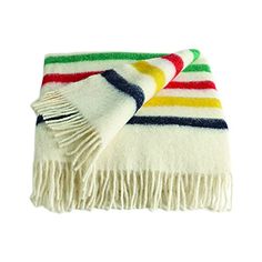 a multicolored striped blanket folded on top of each other