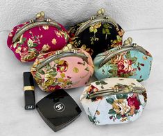 Dimension:   Length(5.5in) x Width(4) x Height(4in) Beautiful, stylized makeup bags, which are unique and currently in fashion.  The makeup bags come in a floral pattern with pink, white, green, and black background colors. The bags have antique gold color kiss lock closure. The bags are stylish. They are popular and functional. They have plenty of room to put makeup. It comes in handy when traveling and the bag can fit in a large purse. The bags open and close at the top middle where a  lock closure is seated. Purse Makeup Bag, Makeup Purse, Birthday Gift Photo, Gift Makeup, Cute Purse, Purse Cute, Wedding Purse, Purse Gift, Cute Handbags