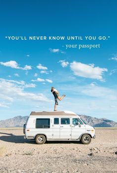 a person standing on top of a van in the middle of an open field with a sky background