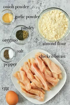 ingredients to make chicken broth laid out on a white plate, including eggs, garlic powder, parsley, parsley and salt