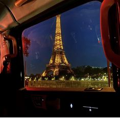 the eiffel tower seen from inside a vehicle