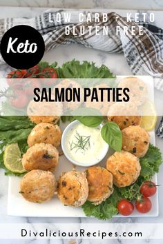 salmon patties on a plate with ranch dressing and lettuce in the middle