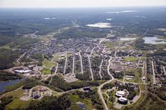 an aerial view of a city surrounded by trees