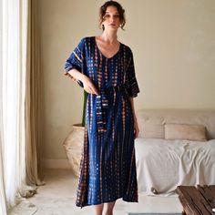 Stand out with this head-turning V-neck sweeping silhouette, this kaftan dress calls to mind dreamy days spent at home or going to a yoga class.  This one-size-fits-most approach will flatter many figures with our everchanging sizing.   We created garments that are meant to last season after season. Each garment is carefully tailored made by our small team of women artisans in Bali from the comfort of their own homes.  100% Rayon. Handmade with love. Handwash cold. Lay flat to dry. 100% Rayon. V-neck Relaxed Fit Maxi Dress For Loungewear, Relaxed Fit V-neck Maxi Dress For Loungewear, V-neck Dresses With Natural Dye, Blue Maxi-length Kaftan For Loungewear, Blue Maxi Kaftan For Loungewear, Blue Flowy Maxi Dress For Loungewear, Blue V-neck Maxi Dress For Loungewear, Blue Relaxed Fit Dress For Loungewear, Relaxed Fit Blue Dress For Loungewear