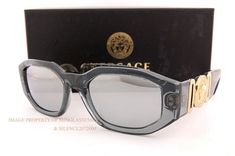 VERSACE Sunglasses     Description Guaranteed 100% Authentic VERSACE Sunglasses. Condition: Brand New. Made in Italy. Model No.  VE 4361    Color:  311/6G (TRANSPARENT GREY FRAMES, SILVER MIRROR LENSES) Original VERSACE Trademark Case, Cleaning Cloth, and Authenticity Cards Included. Size (mm):   Eye | Bridge | Vertical(B) | Temple |   | | |     53 | 18 | 44 | 140 |          SHIPPING & GENARAL INFORMATION We take PayPal only. Free Priority Mail shipping within the US. Please choose Express Mail Glass Theme, Expensive Jewelry Luxury, Versace Sunglasses, Silver Mirror, Expensive Jewelry, Sunglass Lenses, Silver Mirrors, Metal Style, Cleaning Cloth