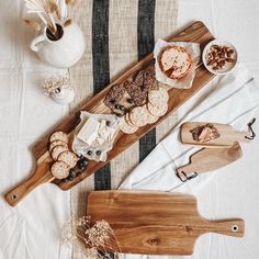 a table topped with cheeses and crackers