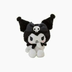 a black and white stuffed animal with a skull on it's head, sitting in front of a white background