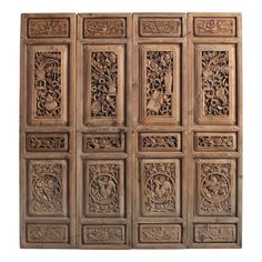 an intricately carved wooden panel with many different designs on the sides and bottom panels