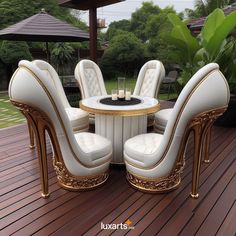 a table with four chairs around it on a deck