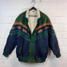 Vintage Navajojacket Size M - XL lined Suede Leather Navajo Jacket Teddy Lining Blouson Bomberjacket 80s 90s Vintage Navajo suede jacket in size M - XL, closes with snap fasteners, one pocket on the right and left Colour: dark green dark blue rust orange brown white Defects: none Dimensions: Length 83cm Width 66cm Arm length from collar 82 cm If you have any questions, just write to me :) Navajo Jacket, Rust Orange, Snap Fasteners, Vintage Navajo, Green Dark, Suede Jacket, 90s Vintage, Suede Leather, Dark Green