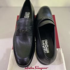 Ferragamo Martin Gancino Penny Loafers Nero. Size 8.5 E. Style #: 0750555. Description: Ferragamo Loafers In Textured Calf Leather Stacked Heel Almond Toe Notched Vamp Gancino Bit-Strap Penny Keeper Strap Leather Lining Slip-On Style "Martin" Is Made In Italy Condition Is Brand New! Comes With Box And Shoe Sleeve. Serial Number: Ln U 10248 8.5e Original Price: $795.00 Plus Tax. Luxury Black Slip-on Oxfords, Designer Tassel Loafers With Rubber Sole For Business, Luxury Business Casual Loafers With Branded Insole, Luxury Tassel Loafers With Textured Sole And Almond Toe, Designer Business Loafers With Rubber Sole, Elegant Tassel Loafers With Textured Sole And Moc Toe, Luxury Loafers With Removable Insole For Semi-formal Occasions, Designer Business Tassel Loafers With Brogue Detailing, Designer Semi-formal Oxfords With Branded Insole