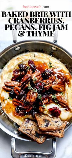 baked brie with cranberries, pecans and thyme in a pan