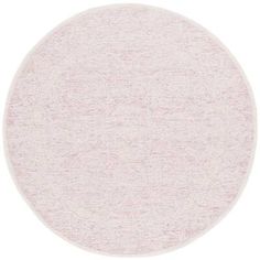 a round rug with white and pink colors