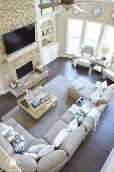 an aerial view of a living room with large couches