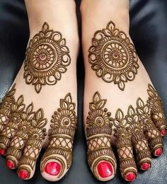 the feet are decorated with henna designs