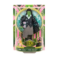 a doll in a box with a green and black outfit