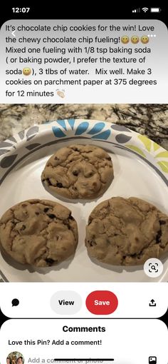 three chocolate chip cookies sitting on top of a white plate next to an email message