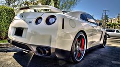 the rear end of a white sports car