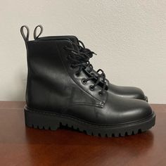 These Are A Brand New Pair Of Valentino Garavani Logo Print Leather Combat Boots In Black Size 45eu/12us Original Box Is Not Included (Comes With Dust Bag) Has Minor Creasing Has Light Scratch Features The Vltn Logo In Black On Both Shoes Leather Upper, Rubber Sole New With Tags Made In Italy Msrp: $1250 Black Lace-up Boots With Lug Sole And Plain Toe, Luxury Black Lace-up Boots With Lug Sole, Black Lace-up Boots With Lug Sole, Black Plain Toe Lace-up Boots In Calf Leather, Black Plain Toe Calf Leather Lace-up Boots, Black Plain Toe Lace-up Calf Leather Boots, Black Calf Leather Lace-up Boots With Plain Toe, Luxury Black Lace-up Boots With Round Toe, Black Combat Boots With Vibram Sole For Work