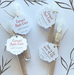 three cinnamon apple cider sticks with labels on them