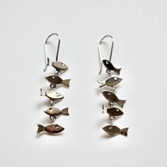 Mino fish sterling silver dangle earrings Silver Fish-shaped Earrings With Ear Wire, Ocean-inspired Sterling Silver Dangle Earrings, Sterling Silver Fish-shaped Jewelry Gift, Silver Sterling Fish-shaped Earrings, Silver Fish-shaped Earrings With Fish Hooks, Sterling Silver Dangle Earrings, Silver Earrings Dangle, Fish, Dangle Earrings