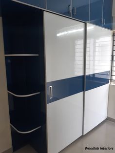 a white and blue cabinet in a room