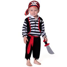 a little boy dressed up as a pirate with a knife in his hand and wearing a striped shirt