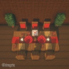 an aerial view of a table and chairs in a living room with red cushions on the floor