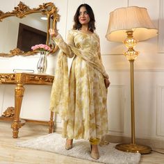 Light Yellow colored anarkali suit is prettified with floral printed work as shown which makes it appear classy. This top is made of georgette fabric which is accompanied with crepe bottom, inner and printed georgette dupatta. Women can buy this suit to wear for their parties and functions. Note:- The actual product may differ slightly in color and design from the one illustrated in the images when compared with computer or mobile screen. Size Chart Size: Semi Stitched/Unstitched can be altered Georgette Dress With Digital Print For Designer Wear, Festive Anarkali Set In Georgette With Printed Motifs, Festive Anarkali Set With Printed Motifs In Georgette, Elegant Georgette Sets With Floral Print, Diwali Georgette Anarkali Set With Printed Motifs, Elegant Georgette Palazzo Set With Floral Print, Fitted Georgette Anarkali Set With Digital Print, Floral Print Georgette Maxi Sets, Georgette Maxi Sets With Floral Print