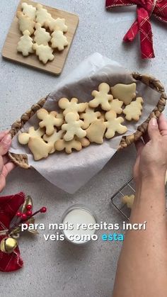 someone is decorating some cookies on the table