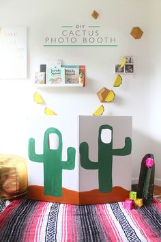 two cardboard boxes sitting on top of a colorful rug in front of a white wall