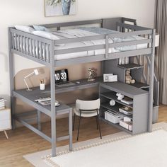 a loft bed with desk underneath it in a room that has hardwood floors and white rugs on the floor