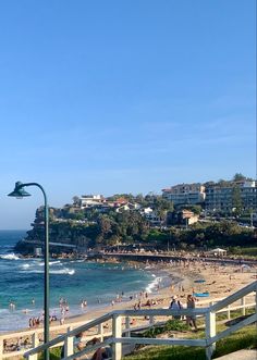 the beach is crowded with people and water