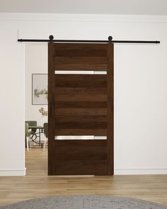 the sliding door is made out of wood and has metal bars on each side, along with white walls