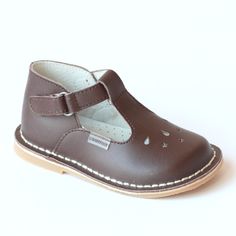 A revamp of the classic mary jane with charming design - perforated stars and teardrops across the front. Available in an assortment of colors. These make excellent shoes for school and outside activi