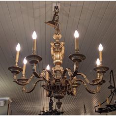 a chandelier hanging from the ceiling in a room