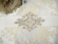 "Exquisite rhinestone applique - high quality crystal rhinestone. Size: Width: 2.8\" (7 cm) Length: 3.6\" (9 cm) Perfect for a DIY bridal garter, bridal dress, wedding dress, bridal sash, belts, headpiece, baby headband (as well as many other DIY projects). Stones are all prong set, and sewn into the mesh backing. Price is for one piece, more in stock. We offer special discounts for designers and wholesale orders! You can choose a express shipping here: https://www.etsy.com/listing/602095820/exp White Crystal Embellished Sashes, White Crystal Embellished Sash, White Embellished Crystal Sashes, Beaded Patches, Wedding Applique, Bridal Sash Belt, Maid Of Honour Dresses, Crystal Belt, Wedding Sash Belt