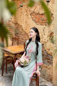 This is an embroidery flower top ao dai with button on the size. Loose form ( ao dai Dang Suong). Color looks exactly like in the model pics.  SET TOP BLUE /PINK PANT MATERIAL: SILK  3/10 stretch Style: Modernized. Model : 5'2  Pls take a look at the size chart before placing order bc we DO NOT ACCEPT RETURN or EXCHANGED. Traditional Embroidered Cheongsam For Spring, Traditional Embroidered Spring Cheongsam, Summer Ao Dai With Floral Embroidery And Long Sleeves, Summer Long-sleeve Ao Dai With Floral Embroidery, Summer Long Sleeve Ao Dai With Floral Embroidery, Traditional Ao Dai With Floral Print, Spring Floral Embroidered Ao Dai, Spring Floral Embroidery Ao Dai, Embroidered Long Sleeve Cheongsam For Spring