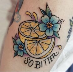 an orange tattoo on the leg with flowers and lettering that says,'so bitter '