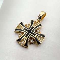 Immerse yourself in divine elegance with our 14k Gold Jerusalem Cross Pendant, adorned with Black Enamel and Zircons, a harmonious blend of spiritual significance and exquisite craftsmanship. 🌟 Meaning of the Jerusalem Cross: The Jerusalem Cross, with its distinctive design featuring four smaller crosses surrounding a central one, holds deep religious symbolism. Each arm represents the foundational Christian virtues of faith, hope, love, and the central message of the Gospel. ⛪️ Pointing to the Symbolic Black Gemstone Jewelry, Black Luxury Enamel Jewelry, Luxury Black Cross Pendant Necklace, Luxury Cross Gemstone Jewelry, Luxury Gemstone Cross Jewelry, Luxury Cross-shaped Gemstone Jewelry, Symbolic Black 14k Gold Jewelry, Gold Diamond Necklace With Black Enamel, Traditional Black Jewelry With Polished Finish